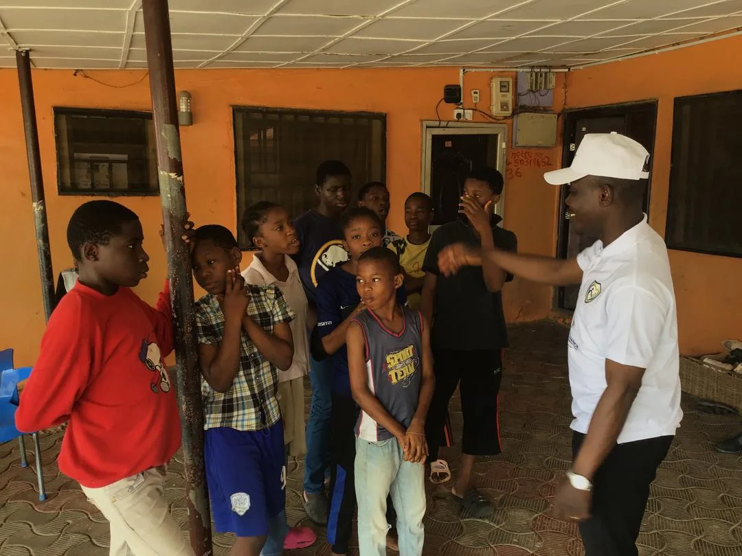 Children greet and gather around LAHF volunteers at City of Refuge Orphanage