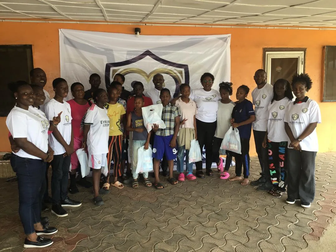 Children and LAHF volunteers gather for a group portrait at City of Refuge Orphanage