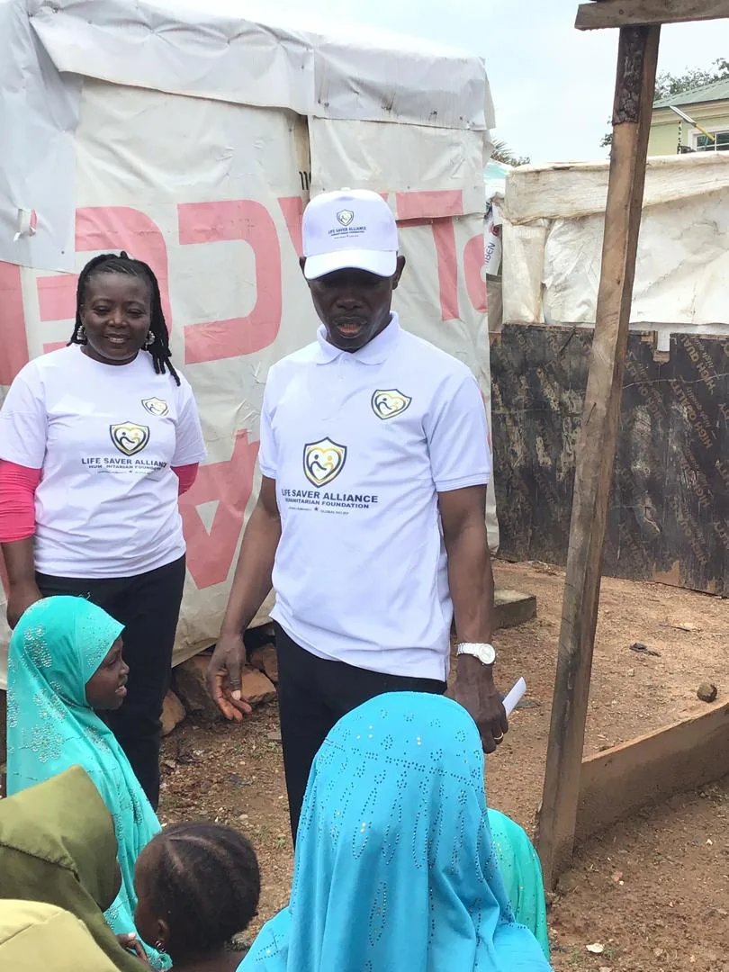 LAHF team members talk with children at the beginning of the community visit