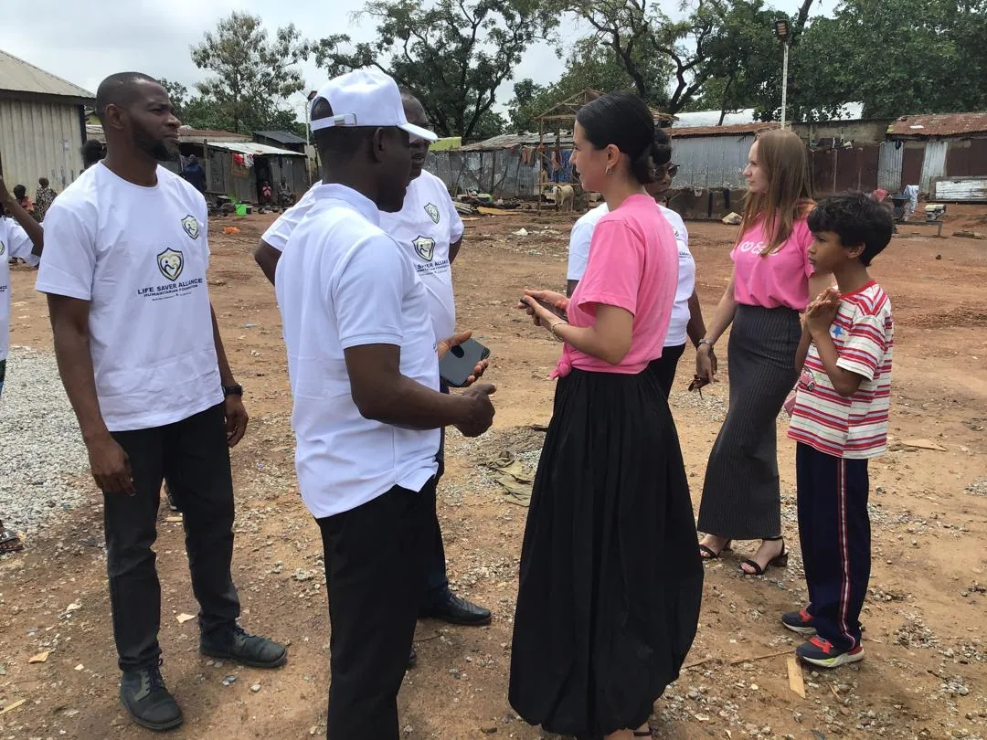 LAHF volunteers speak with visitors and community members during the Durumi 1 outreach