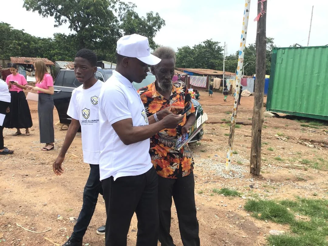 LAHF volunteers speak with visitors and community members during the Durumi 1 outreach