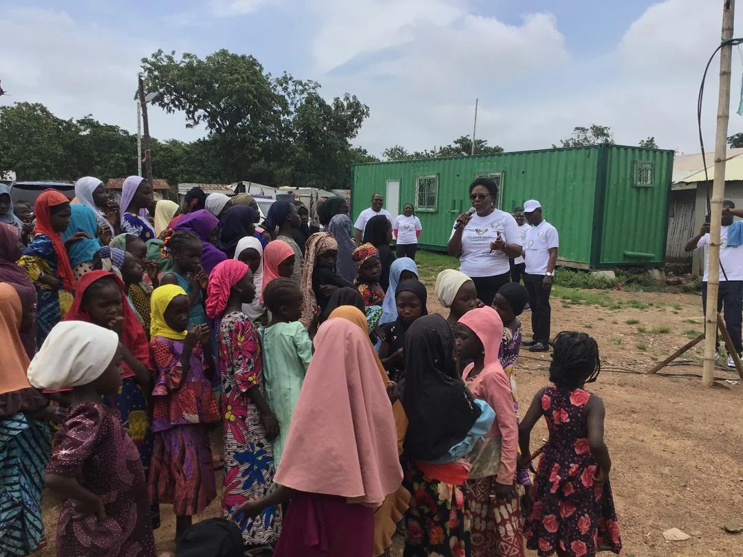 LAHF volunteers address children and families gathered at the Durumi 1 IDP camps