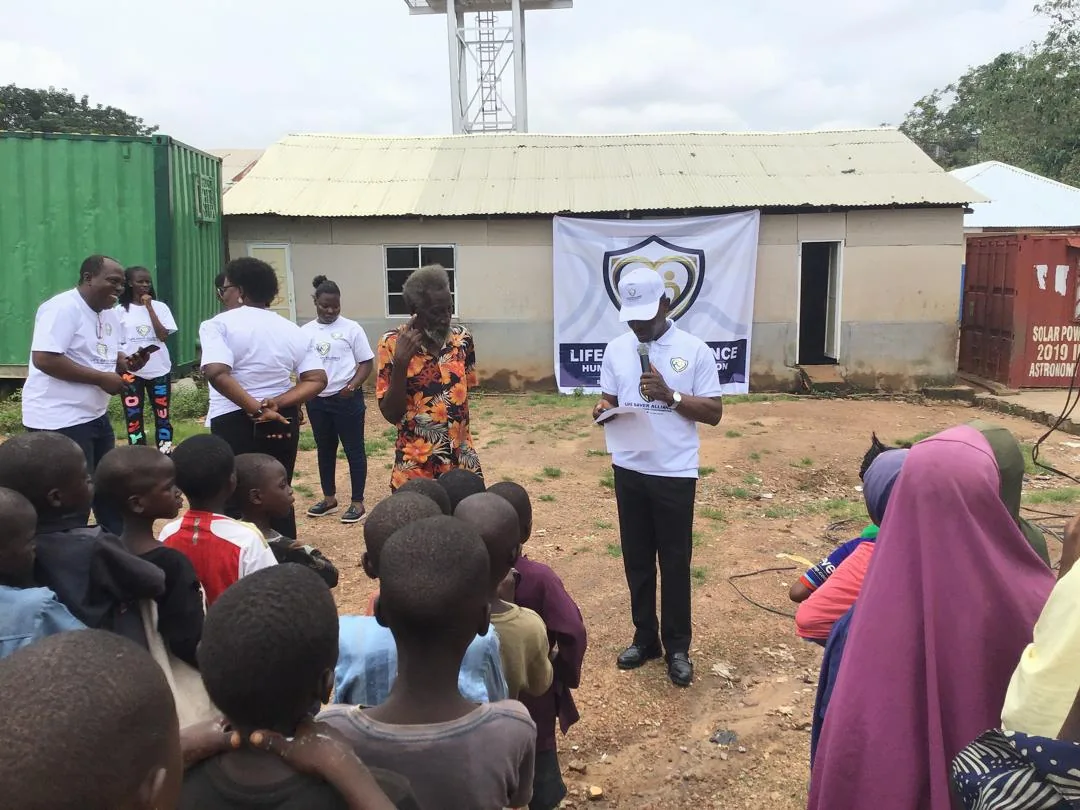 LAHF volunteers address children and families gathered at the Durumi 1 IDP camps